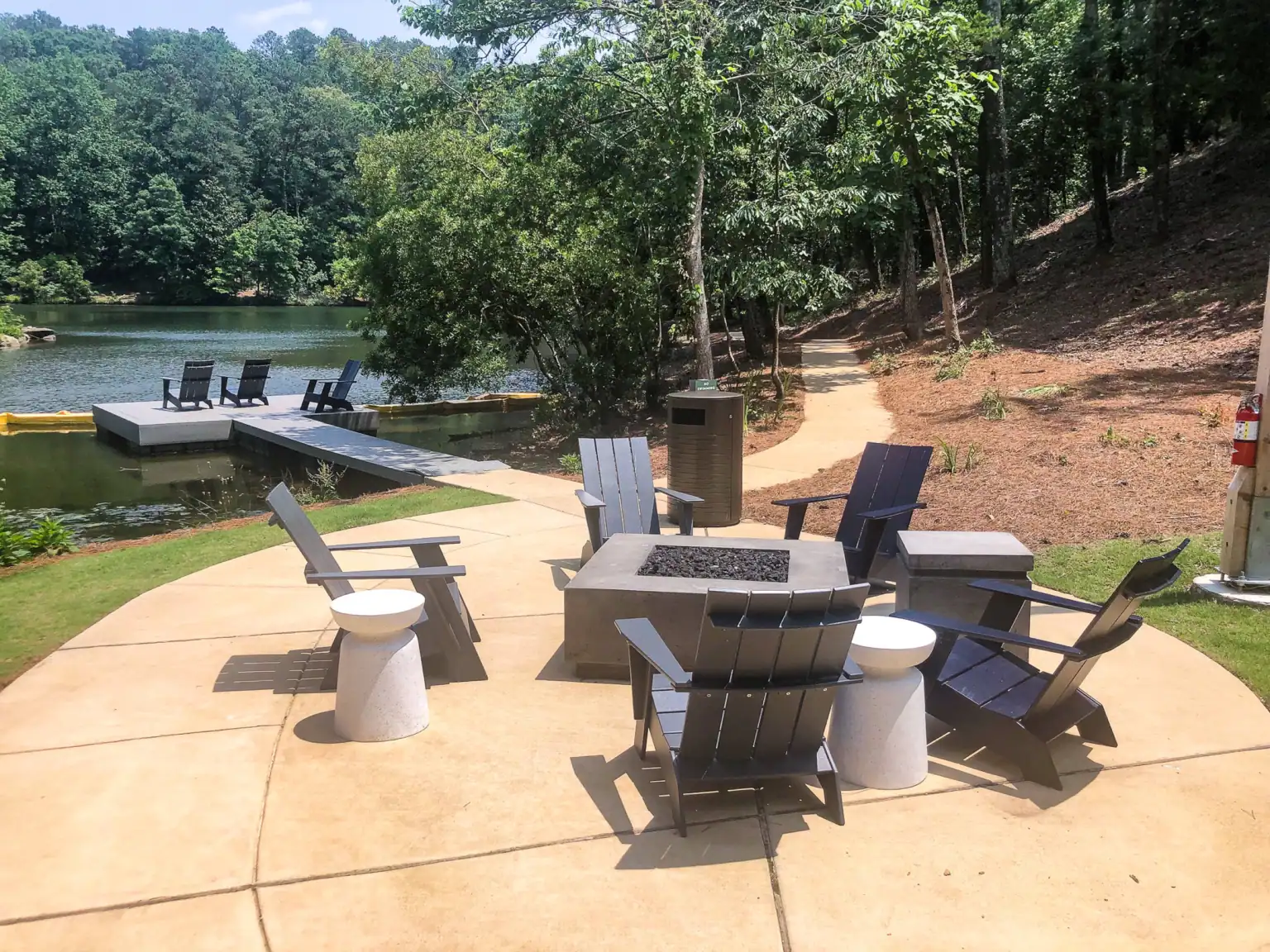 Outdoor seating beside the lake at Tributary