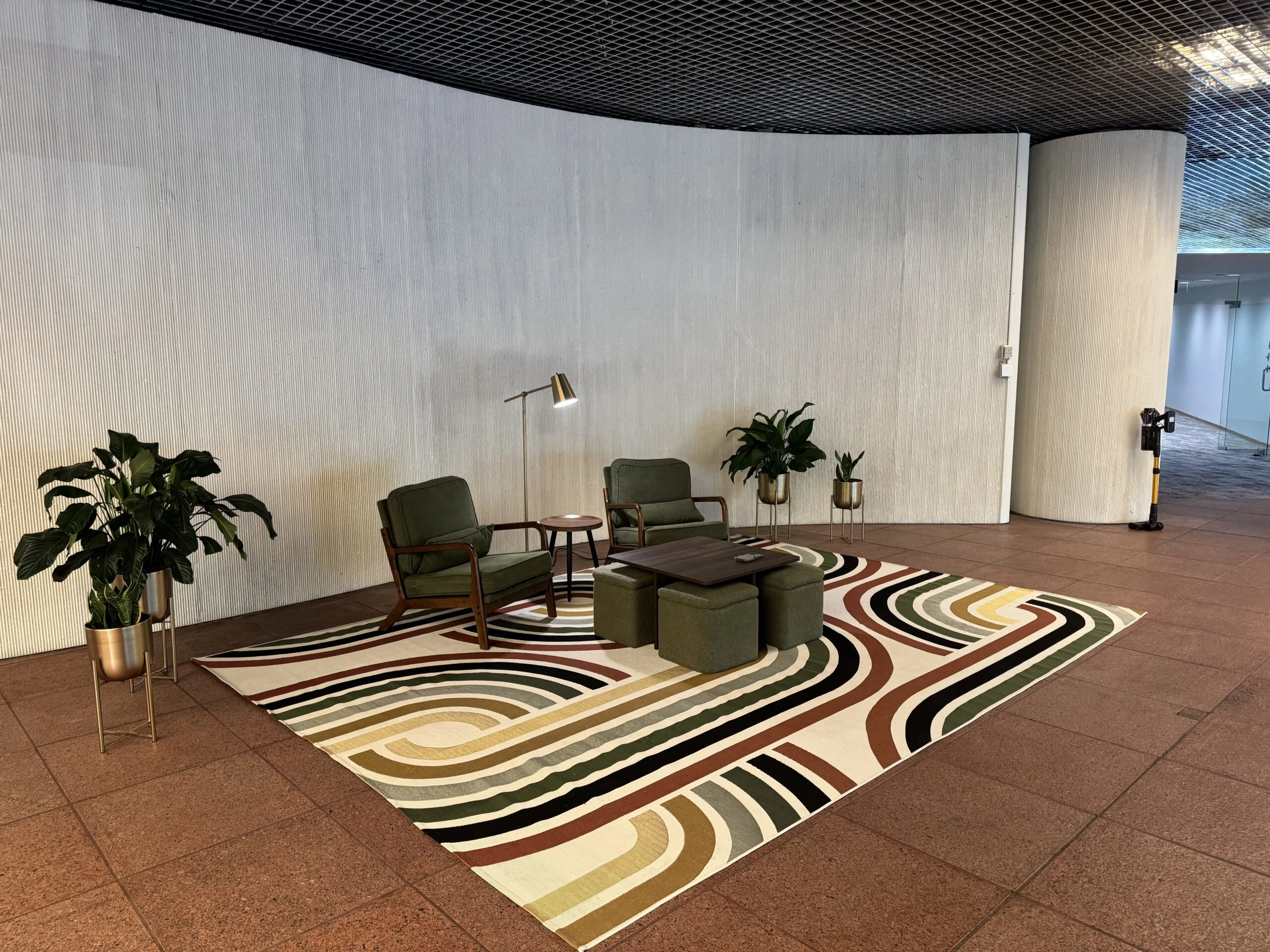 Shared lobby seating and gathering area inside the Tributary building