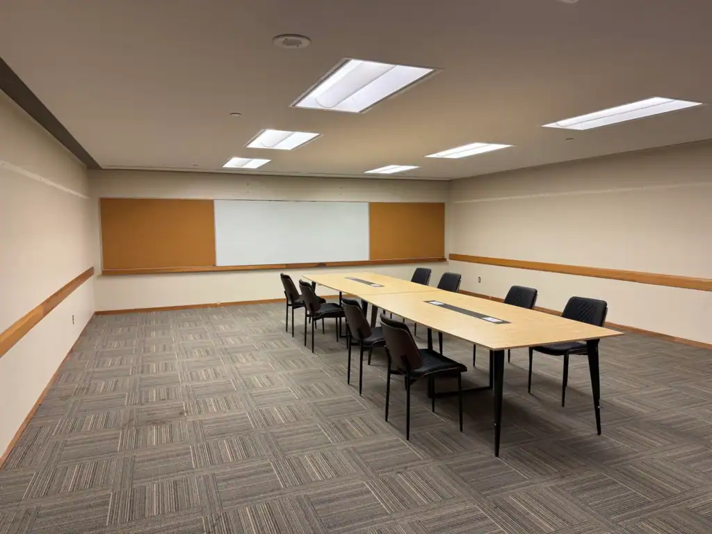 Conference room at Tributary with a long meeting table and chairs