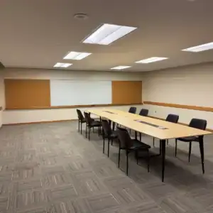 Conference room at Tributary with a long meeting table and chairs