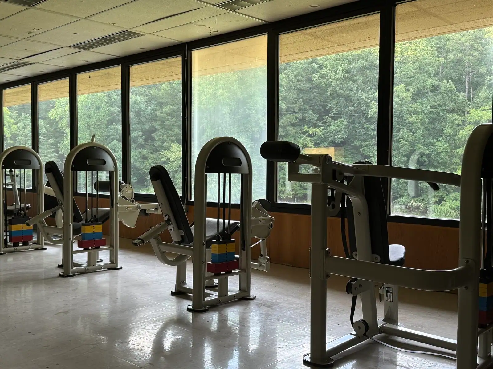 Star Trac weight-training machines beside the windows in the Tributary fitness room