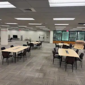 Shared work tables and seating in the Tributary coworking area